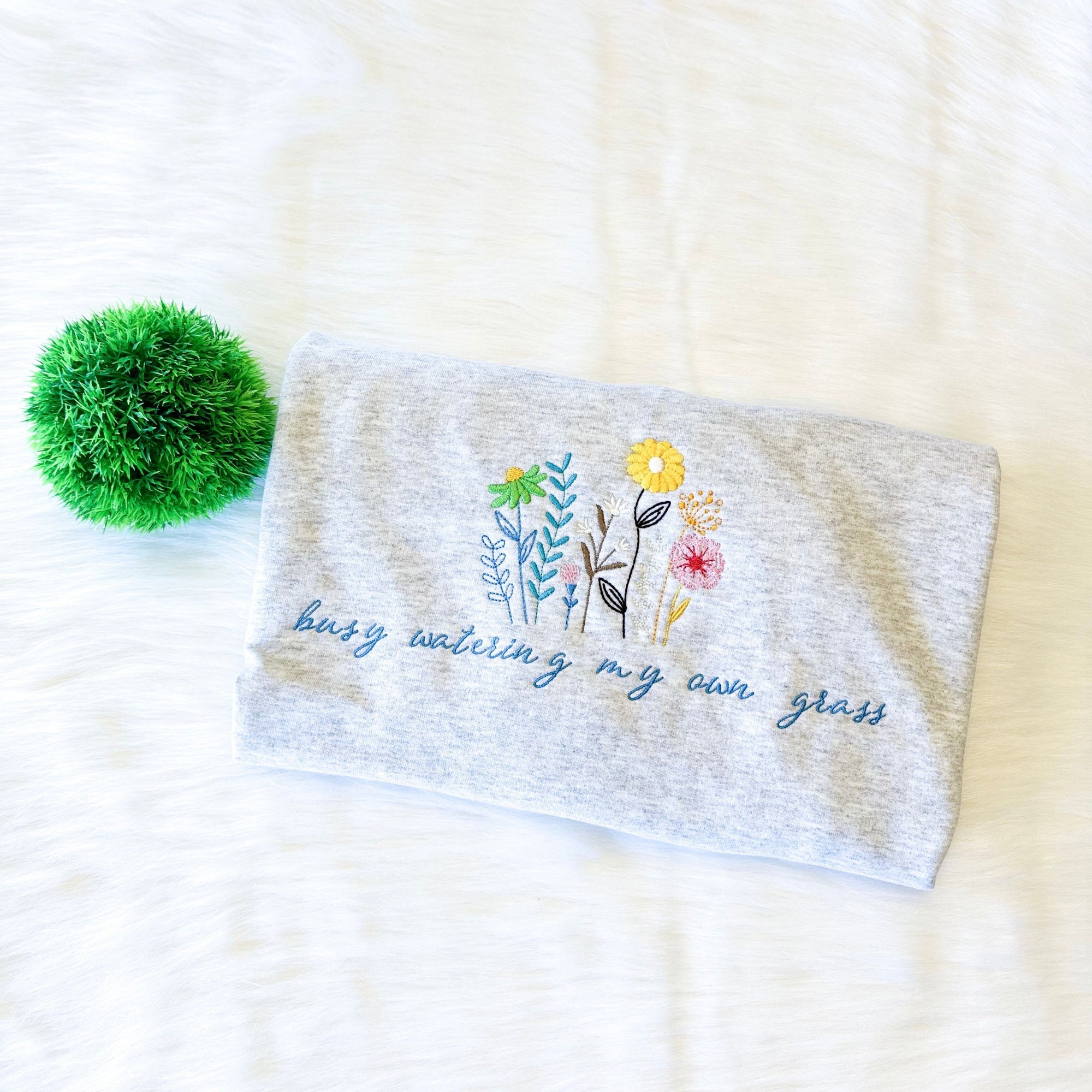 Busy watering my own grass embroidered sweatshirt