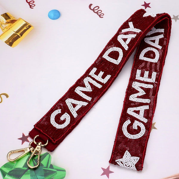 Red and white adjustable bag strap with metal clasps