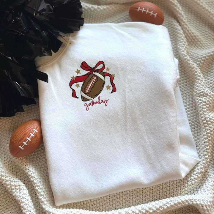 embroidered football and bow left chest sweatshirt