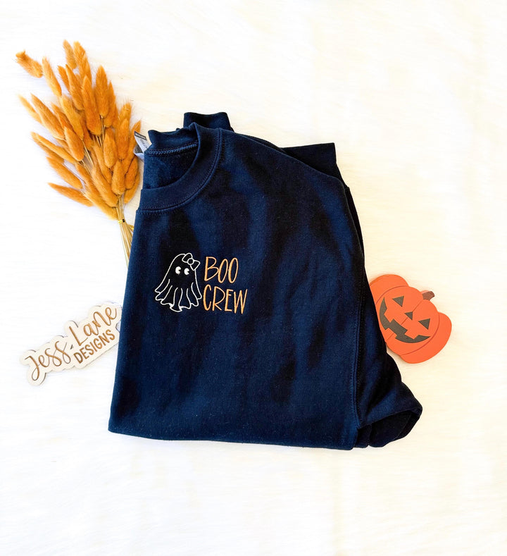 Comfort Colors Halloween Crewneck Black Pullover Sweatshirt Custom Embroidered Ghost Design Boo Crew Graphics Orange Accent Details Left Chest Embroidery Placement Cozy Fleece Material Perfect Spooky Season Outfit Fall Clothing Essential