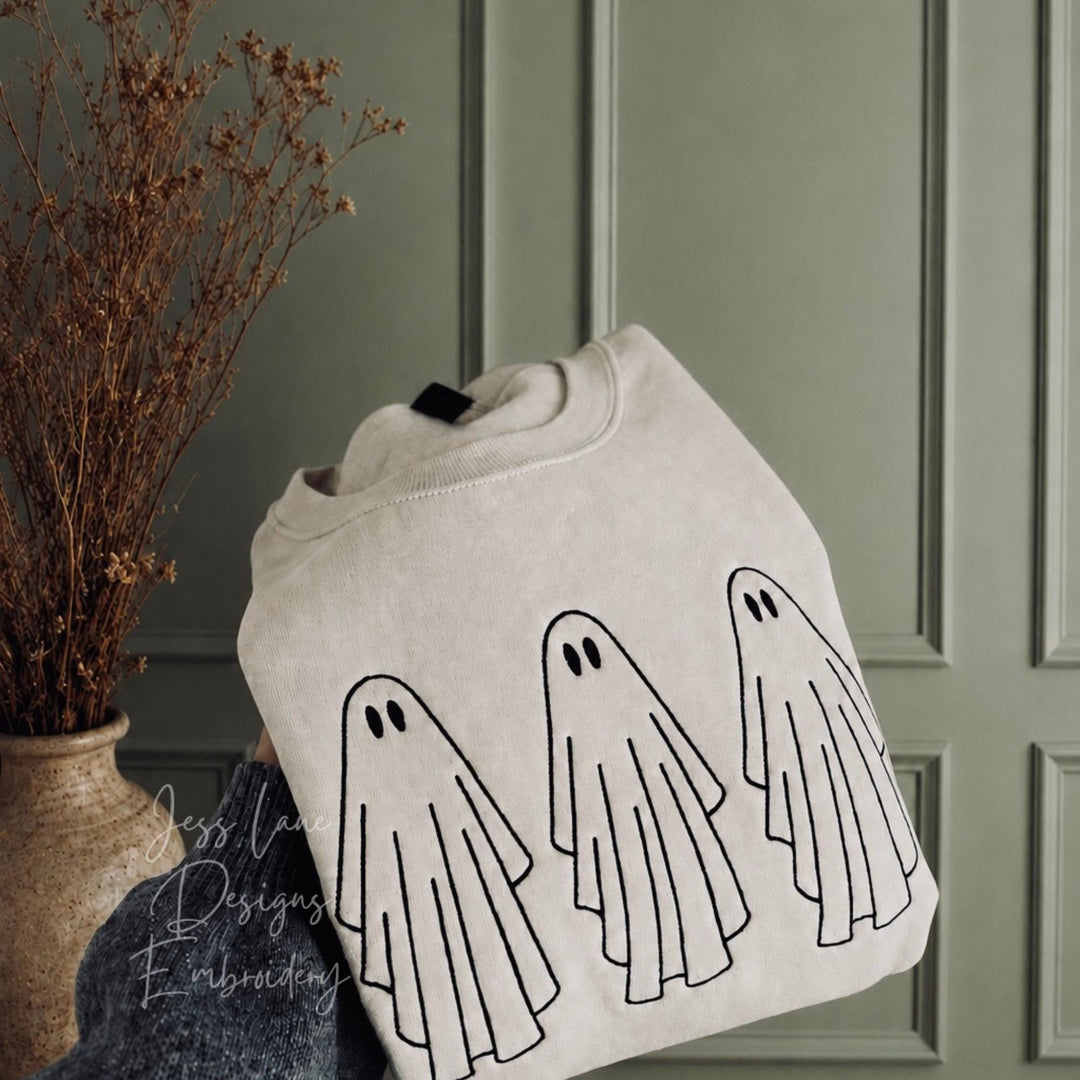 embroidered ghost Halloween sweatshirt on a Gildan sand sweatshirt with black thread