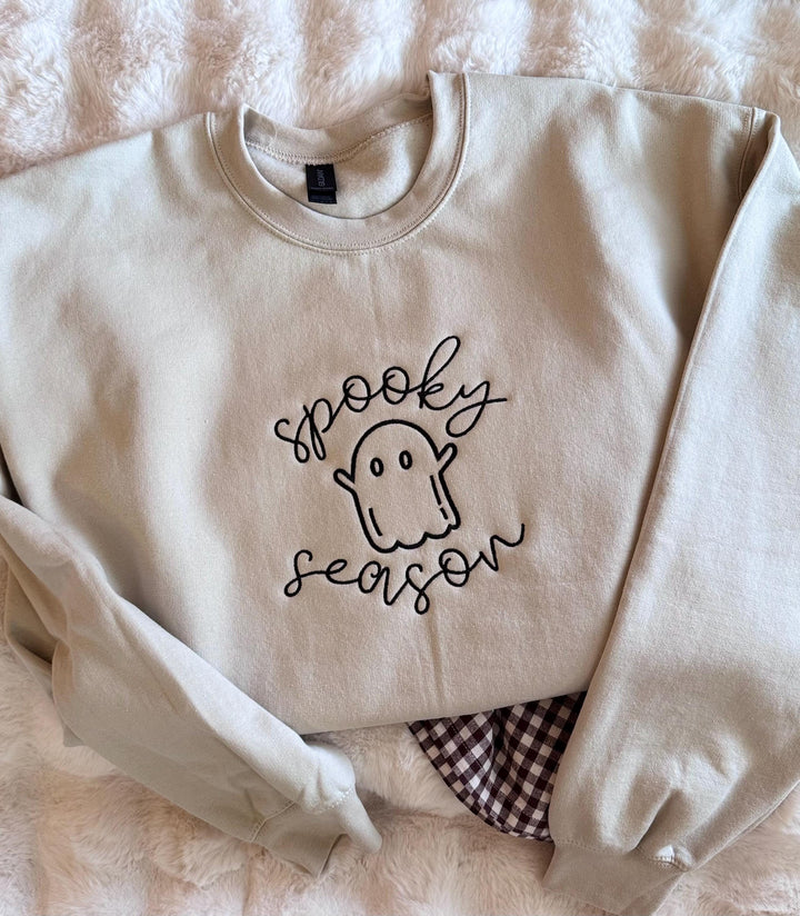 Jerzees sand embroidered ghost crewneck sweatshirt styled flat with cozy autumn fall decor