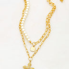 TWO NECKLACES SET WITH PEARL AND CROSS