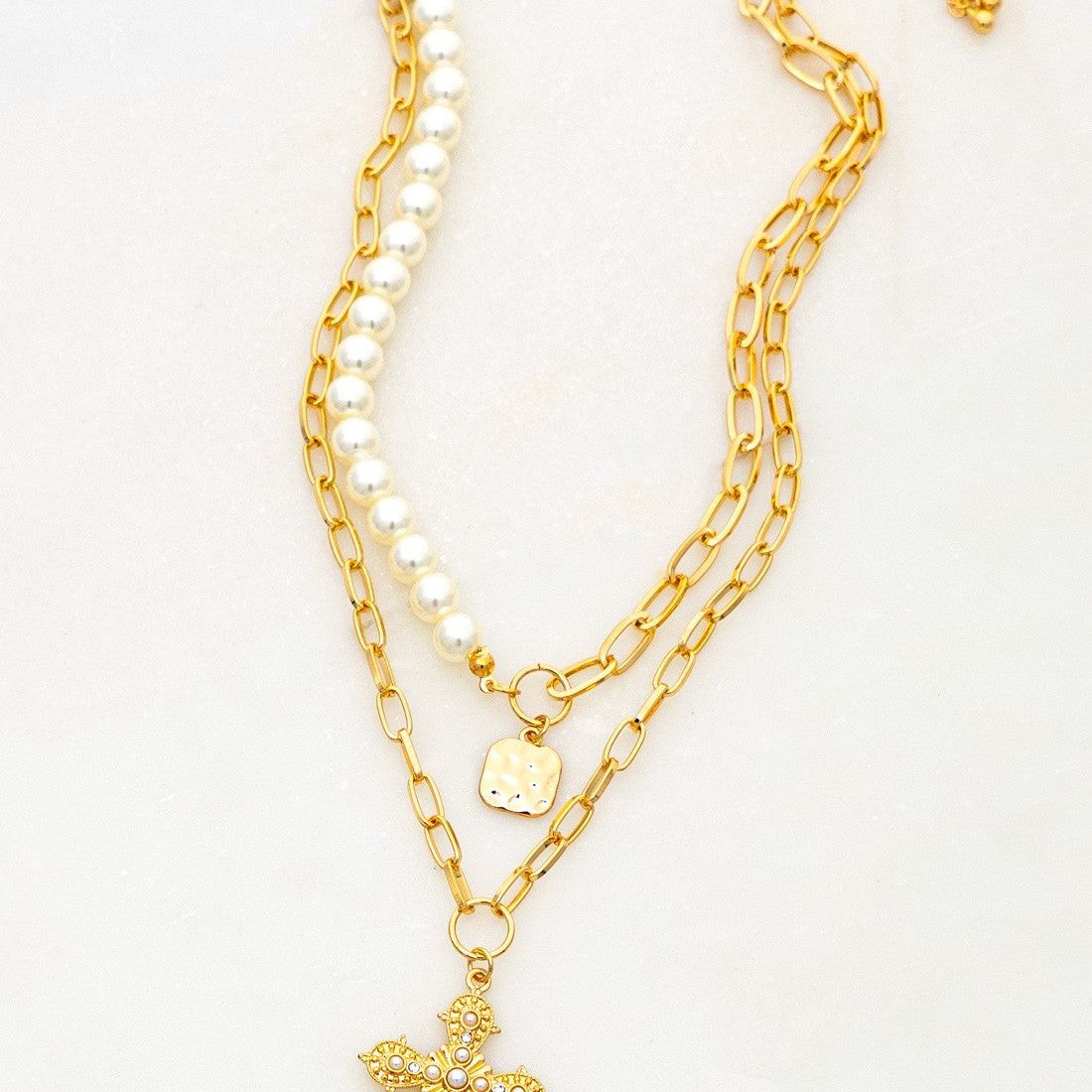TWO NECKLACES SET WITH PEARL AND CROSS