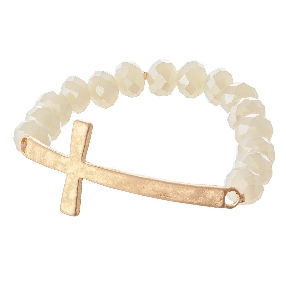 Facet Beaded Stretch Bracelet Featuring an East West Cross Focal. 
